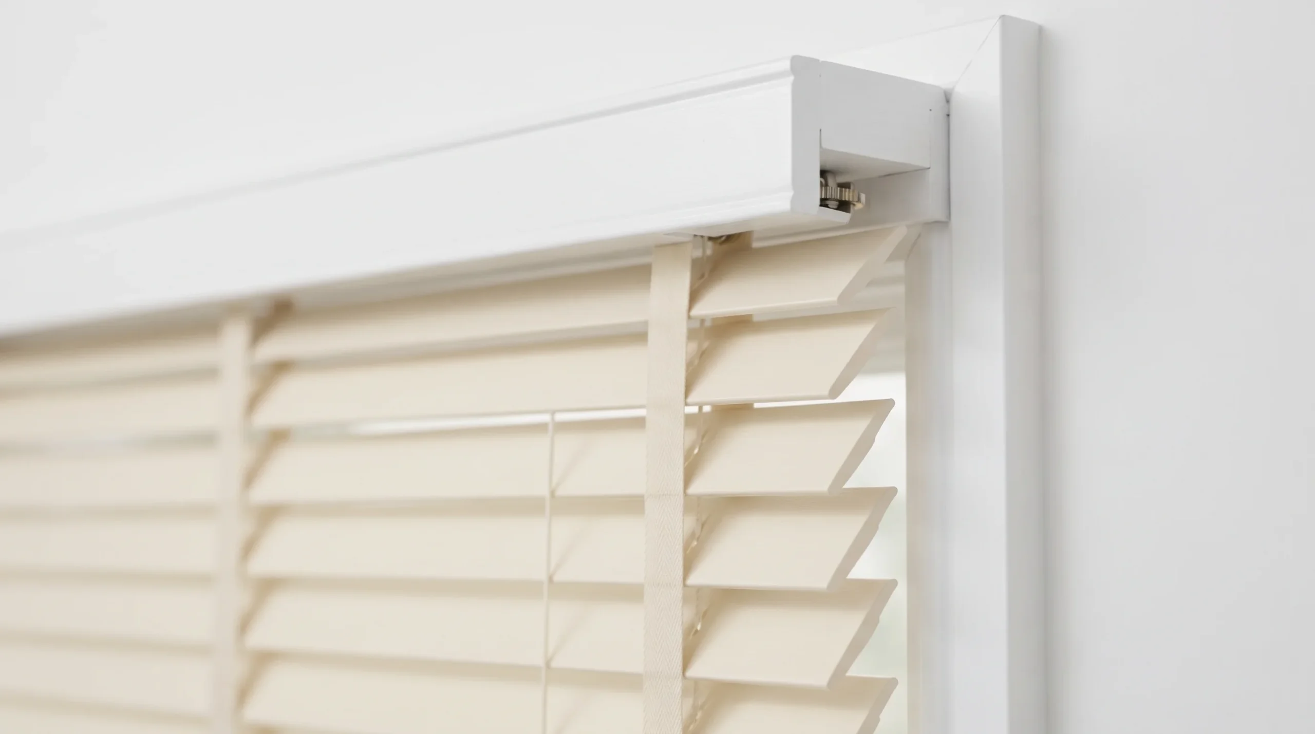 cream wood blind headrail and mounting bracket detail cream wood blind headrail and mounting bracket detail