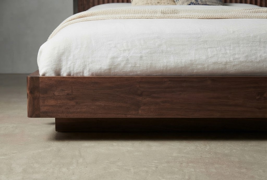 kinetixscaleinteriors walnut wood bed frame footboard base closeup kinetixscaleinteriors walnut wood bed frame footboard base closeup